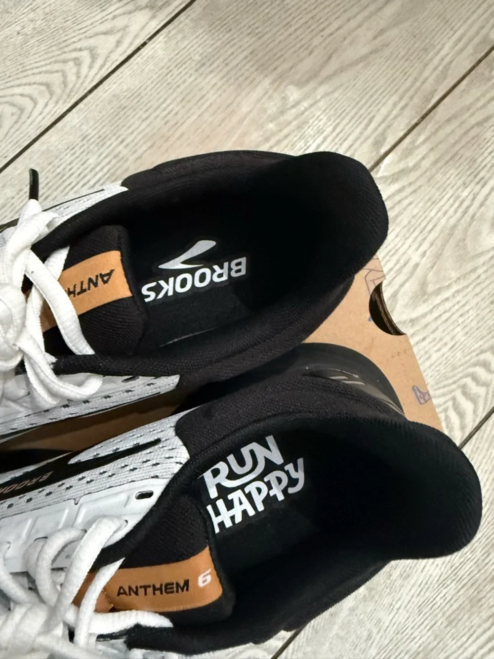 Brooks White and Black Athletic Running Sneakers with Orange Accents